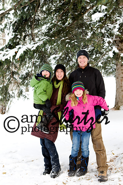 A handsome Bozeman family poses for a winter photograph.