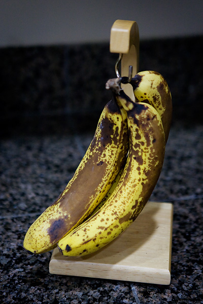 Three overripe bananas look perfect for making banana bread.