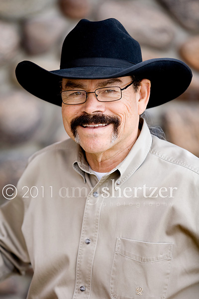 A rancher poses for a professional photo in Bozeman, MT.