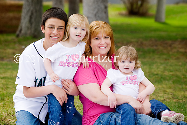 A mom poses with her 3 children in Bozeman, MT.
